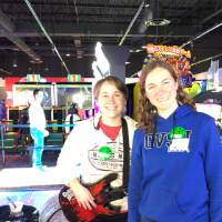 women playing Guitar Hero